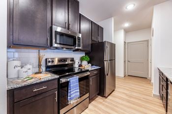 Designer kitchens with granite countertops and shaker style cabinets