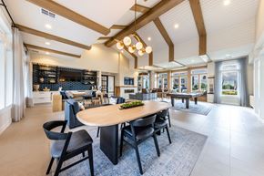 Austin apartment for rent - A modern dining room with a large table and chairs.