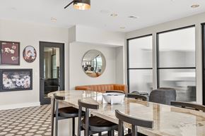 Nashville apartment for rent - A modern dining room with a marble table and chairs.
