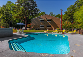 Longview apartment for rent - a swimming pool with a house in the background