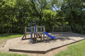 Franklin apartment for rent - A playground with a blue slide and a wooden structure.