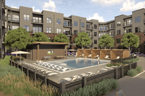 Omaha apartment for rent - A pool surrounded by a black fence and a building in the background.