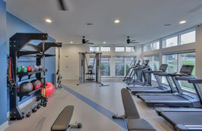 Nashville apartment for rent - A spacious gym with treadmills, weights, and exercise equipment.