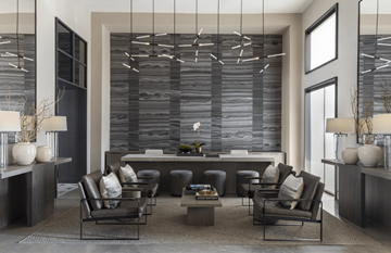 Spring apartment for rent - A modern living room with a large sectional sofa and a coffee table.