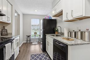 Marietta apartment for rent - a kitchen and dining area in a 555 waverly unit