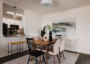 Chattanooga apartment for rent - a dining room with a table and chairs and a kitchen