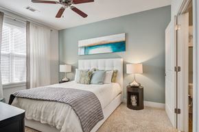 Atlanta apartment for rent - a bedroom with a bed and a ceiling fan
