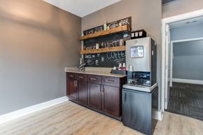 Atlanta apartment for rent - a kitchen with wooden cabinets and a refrigerator and a counter top
