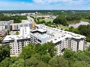 Marietta apartment for rent - A large white building with a pool in the middle of it.