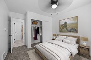 El Paso apartment for rent - A bedroom with a large bed and a painting on the wall.