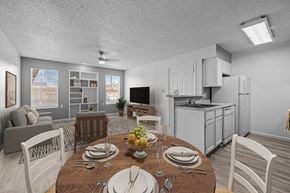 El Paso apartment for rent - A dining room with a table set for a meal.