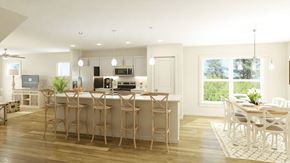 Charlotte townhouse for rent - A modern kitchen with a bar area and a dining table.