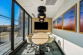 San Diego apartment for rent - A conference room with a table, chairs, and a television.
