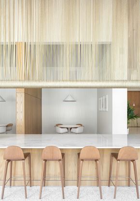 St. Petersburg apartment for rent - A kitchen with a bar counter and three stools.