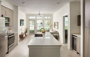 St. Petersburg apartment for rent - A modern kitchen with a large island in the middle.