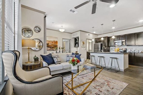 College Station apartment for rent - A modern living room with a white sofa and a coffee table.