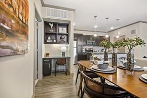 College Station apartment for rent - A modern kitchen with a dining table set for two.