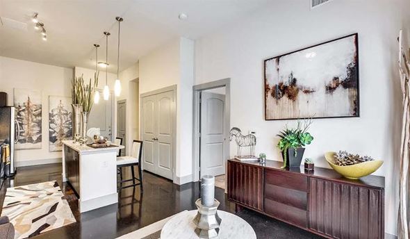 Dallas apartment for rent - a living room with a table and a kitchen