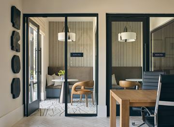 Katy apartment for rent - A modern dining area with a wooden table and chairs.