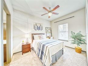 San Marcos apartment for rent - a bedroom with a bed and a ceiling fan