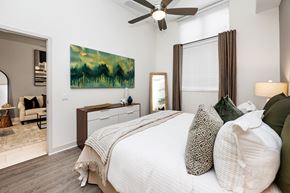 Fort Lauderdale apartment for rent - A bedroom with a large bed and a painting on the wall.