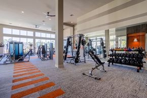 Humble apartment for rent - A gym with orange stripes on the floor.
