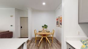 Dallas apartment for rent - a dining room with a wooden table and chairs