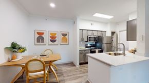Dallas apartment for rent - a kitchen and dining room with a table and chairs