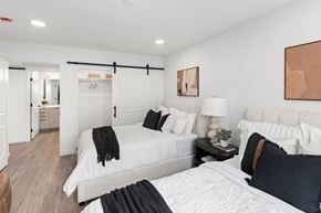 Jackson apartment for rent - A bedroom with two beds and a couch.