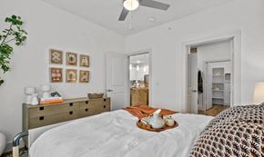 Burleson apartment for rent - a bedroom with a large bed and a closet