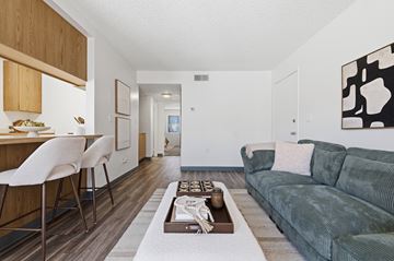 Yuma apartment for rent - A living room with a green couch and a coffee table.