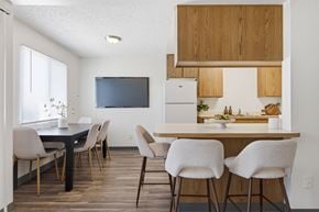 Yuma apartment for rent - A modern kitchen with a dining table and chairs.