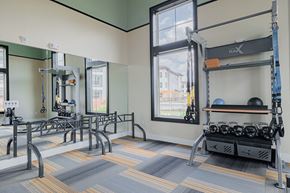 Houston apartment for rent - a weight room at the callaway house austin