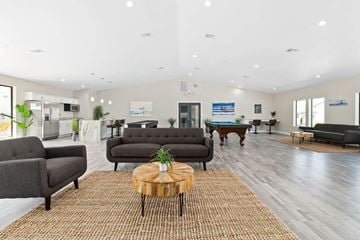 Dallas apartment for rent - a living room with couches and a pool table