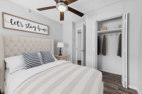 Austin apartment for rent - a bedroom with a large bed and a ceiling fan