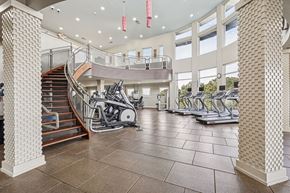 Atlanta apartment for rent - A gym with treadmills, elliptical machines and a staircase.