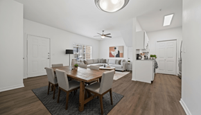 New Braunfels apartment for rent - A dining room with a wooden table and chairs.
