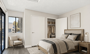 Riverside apartment for rent - A bedroom with a bed, chair, and a window overlooking a city.