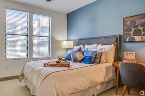 Tempe apartment for rent - a bedroom with a large bed and two windows