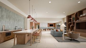 Denton apartment for rent - A modern kitchen with a long island and bar stools.