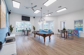 Houston apartment for rent - A room with a pool table and a television.