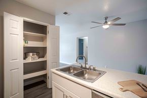 Rocklin apartment for rent - a kitchen with a sink and a ceiling fan