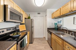 Fort Myers apartment for rent - a kitchen with stainless steel appliances and granite counter tops and
