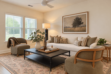 Moncks Corner townhouse for rent - A living room with a couch, chair, and a painting on the wall.