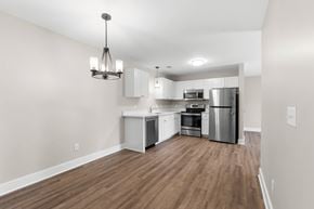 South Lyon apartment for rent - A kitchen with wooden floors and stainless steel appliances.