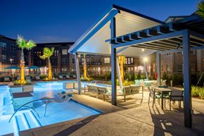 Cypress apartment for rent - night time pool view