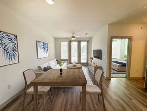 Cypress apartment for rent - A dining room with a wooden table and chairs.
