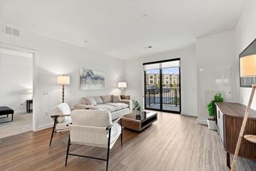 Lombard apartment for rent - A living room with a white couch and a wooden floor.