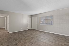 Tucson apartment for rent - Living room with wood-style flooring at Zona Village Apartments in Tucson, AZ near Downtown and U of A