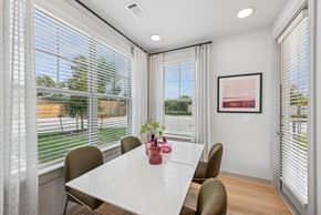 Hockley apartment for rent - A dining room with a table, chairs, and a window with blinds.